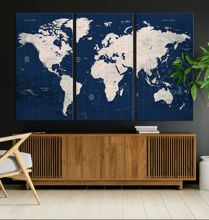 Large modern world map wall art canvas print in beige and navy; showcases a 3-panel vintage map design and is ready to hang.