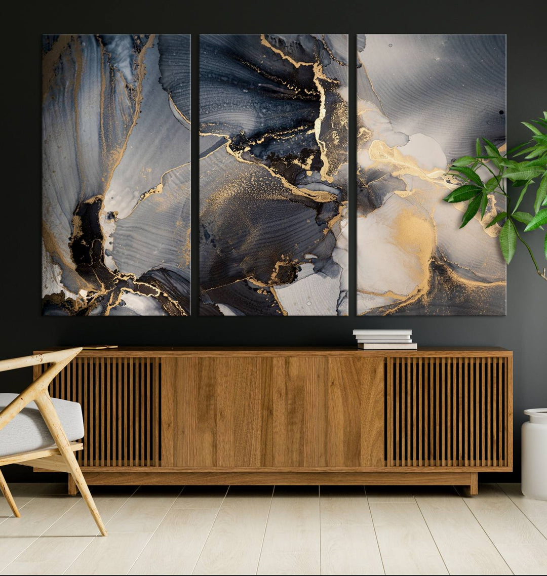 A Modern Marble Fluid Effect Abstract Wall Art with black, white, and gold swirls hangs in a modern kitchen.