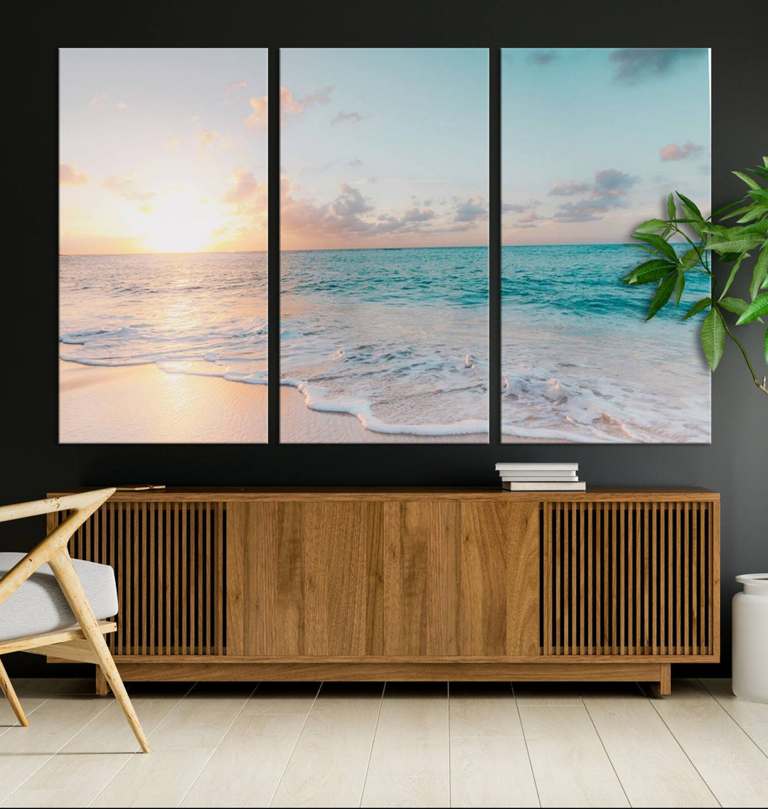 The room features a 3-panel Tranquil Ocean Beach Sunset Canvas Wall Art.