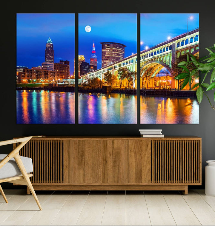 A Cleveland Night Skyline Wall Art on museum-quality canvas showcases a bridge and illuminated buildings.