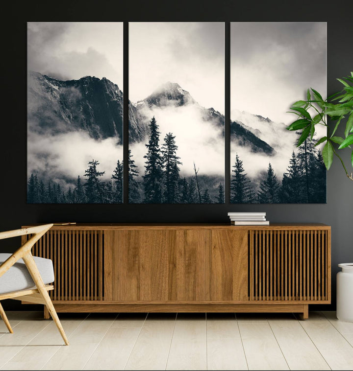 A large foggy mountain forest canvas print hangs prominently in the room.