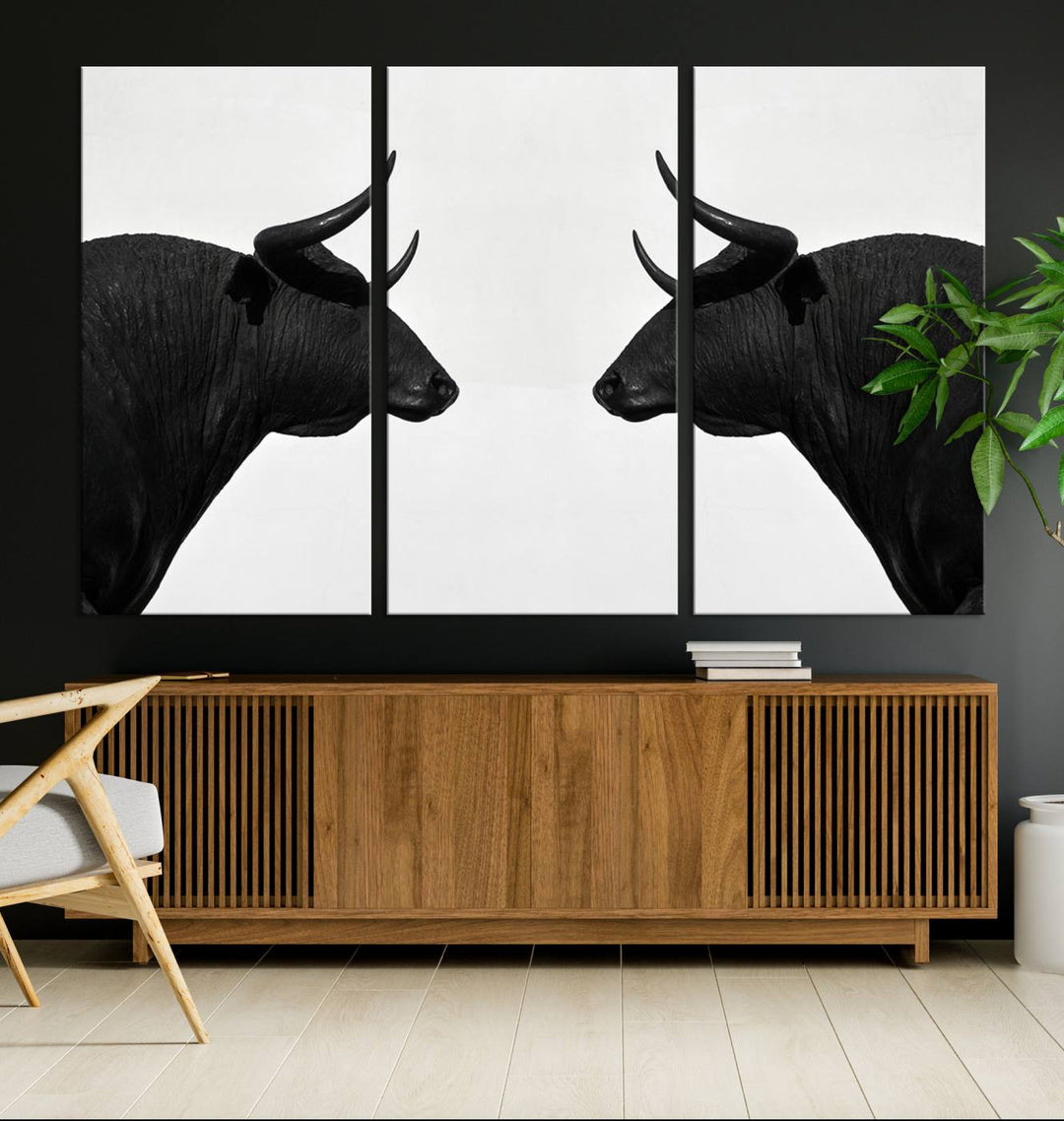 Spanish Bull Wall Art Canvas Print: Two black bull heads facing off on museum-quality canvas.