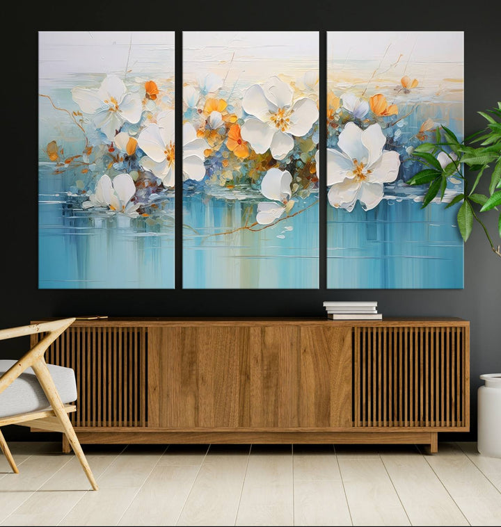 An Abstract Flower Wall Art Canvas Print in blue and orange hues.