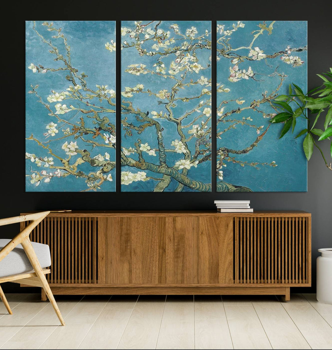 The wall art, Vincent Van Goghs Almond Blossom, stands out with its vibrant depiction against a serene blue background.