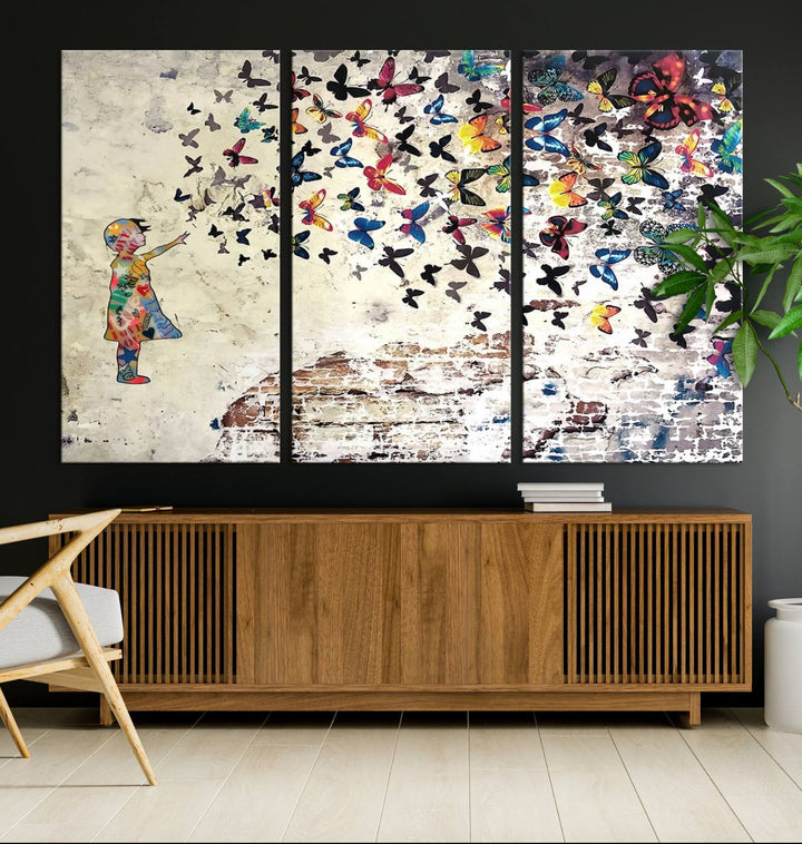 A Banksy Girl Butterfly Canvas Print is displayed on the textured wall.