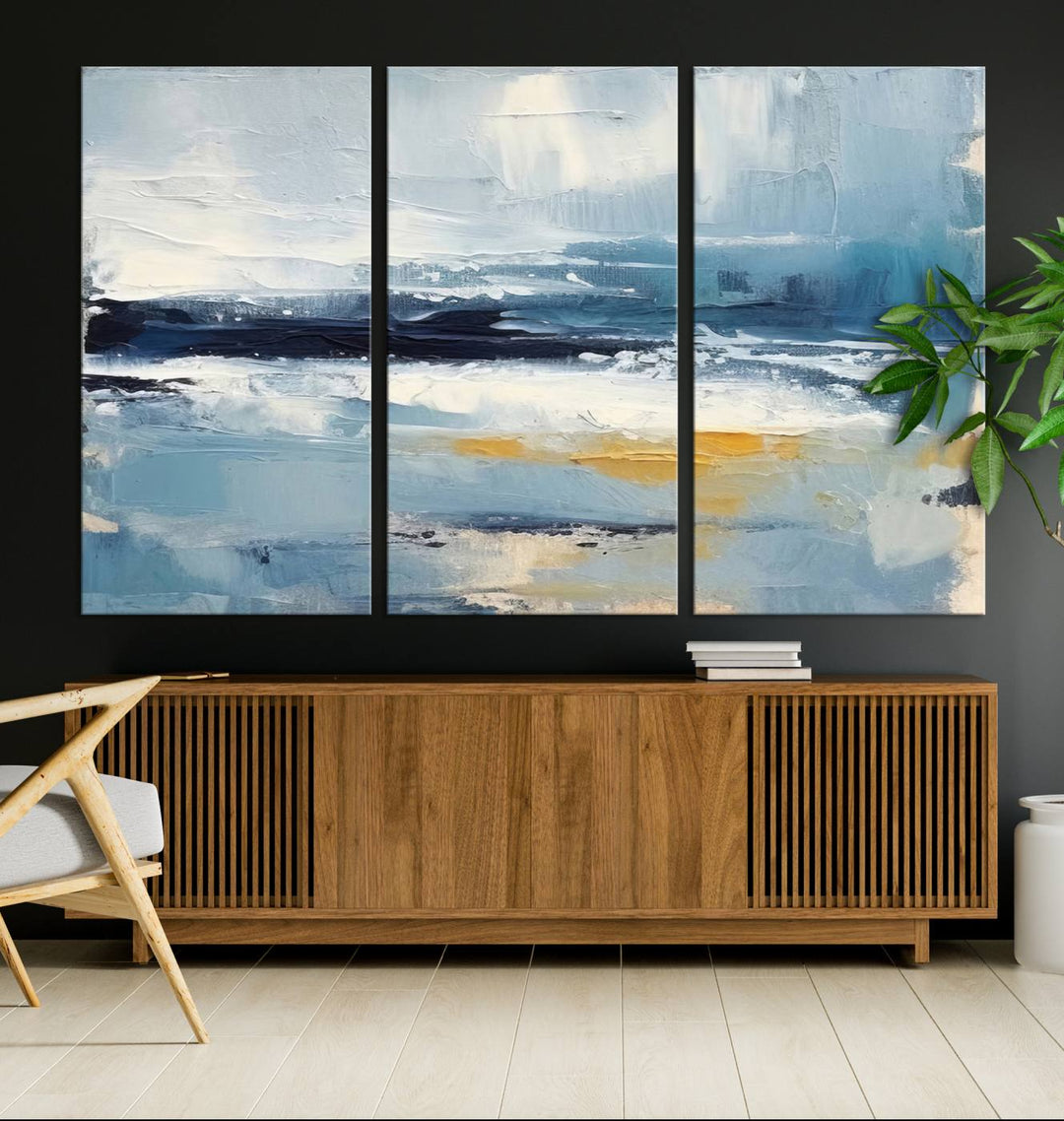 The Abstract Ocean Canvas Wall Art in coastal blue and gold enhances the modern kitchen.