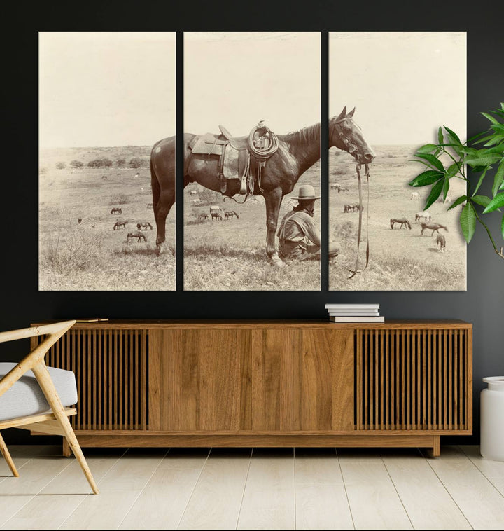 Cowboy Wall Art - Vintage Western Horse Canvas Print features a cowboy kneeling by his horse in a field.