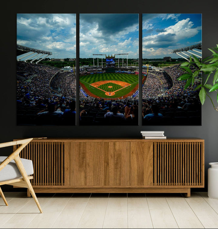 A 3-panel print of Kauffman Stadium, showcasing a crowded baseball field under cloudy skies.