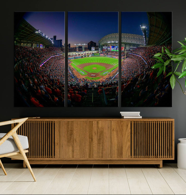 A canvas print of Houston Minute Maid Park at dusk is mounted on the wall.