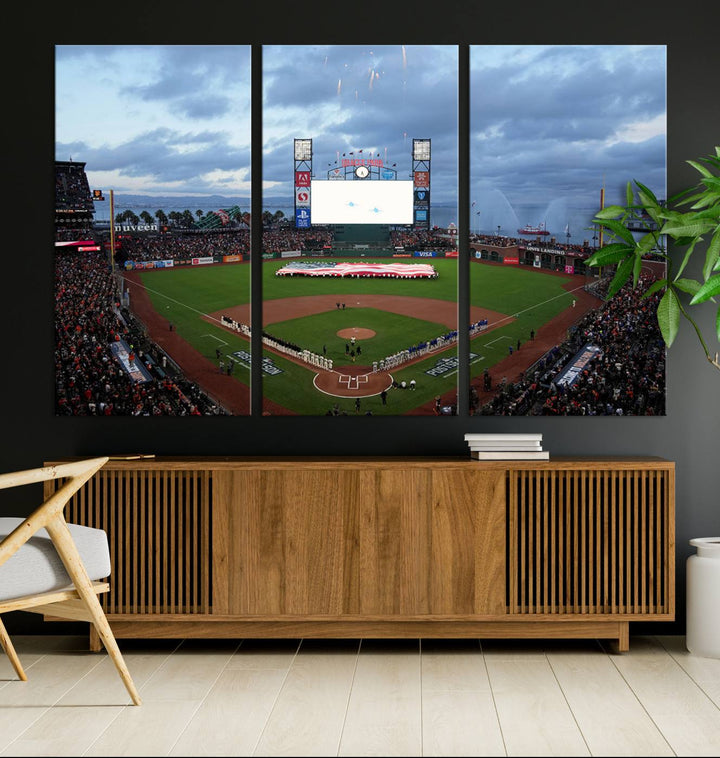 This framed 3-panel canvas MLB wall art features a giant flag and fans under a cloudy sky at Oracle Park.