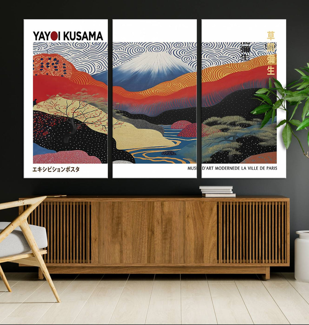 The vibrant abstract landscape canvas print featuring the Framed Yayoi Kusama 1986 Wall Art adds a touch of contemporary décor to the room.