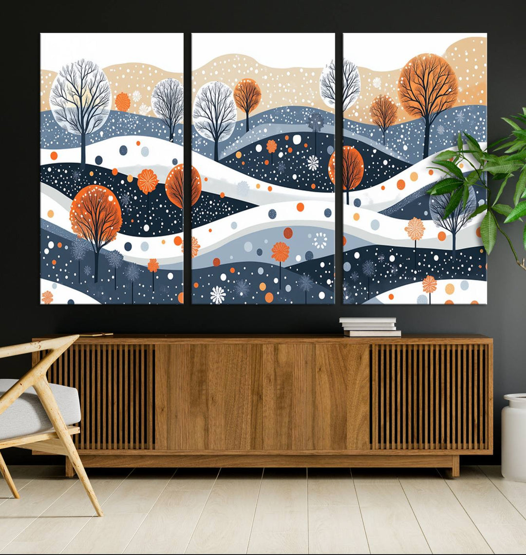 The "Abstract Winter Landscape Canvas Wall Art Print," featuring a triptych of landscapes with trees and hills in vibrant orange, white, and blue hues, adds a gallery-quality finish that transforms the space into an art lover's dream.