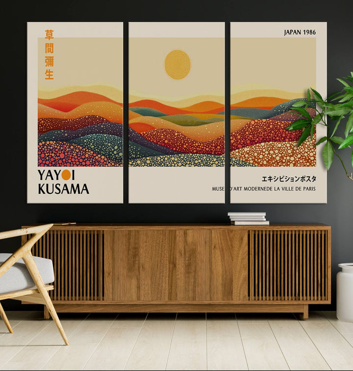 The Yayoi Kusama Wall Art Print is a vibrant abstract landscape canvas featuring colorful, dotted hills and a sun, reminiscent of Yayoi Kusama's iconic designs.