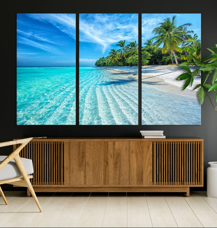 The Tropical Beach Wall Art Canvas Print showcases a serene ocean landscape with crystal clear turquoise water and palm trees, beautifully enhancing the coastal decor.