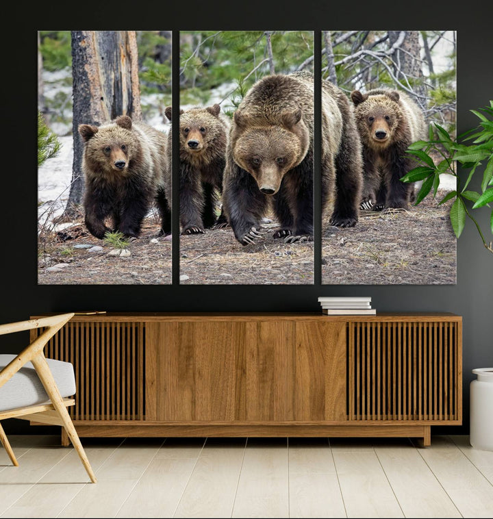 The Grizzly 399 and Cubs in Wild Flowers Wall Art Canvas Print, depicting grizzly bears amidst wildflowers, is elegantly displayed.