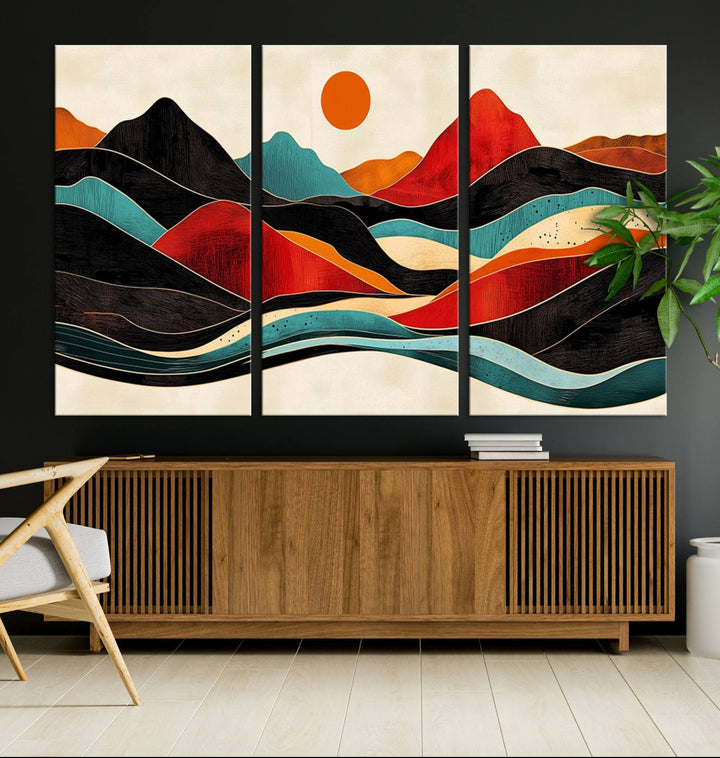 The Colorful Western Triptych Canvas features a vibrant mountain and sun design, making it perfect for modern kitchens or log cabin walls.