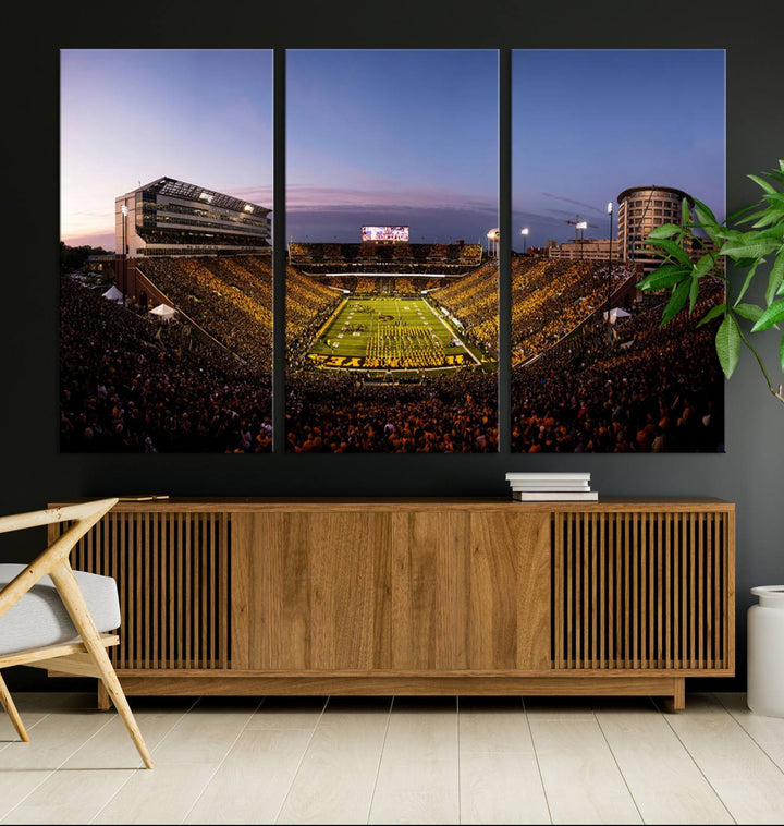 The Iowa Hawkeyes Kinnick Stadium Wall Art Canvas Print captures a sunset scene, making it perfect for display on a wall.