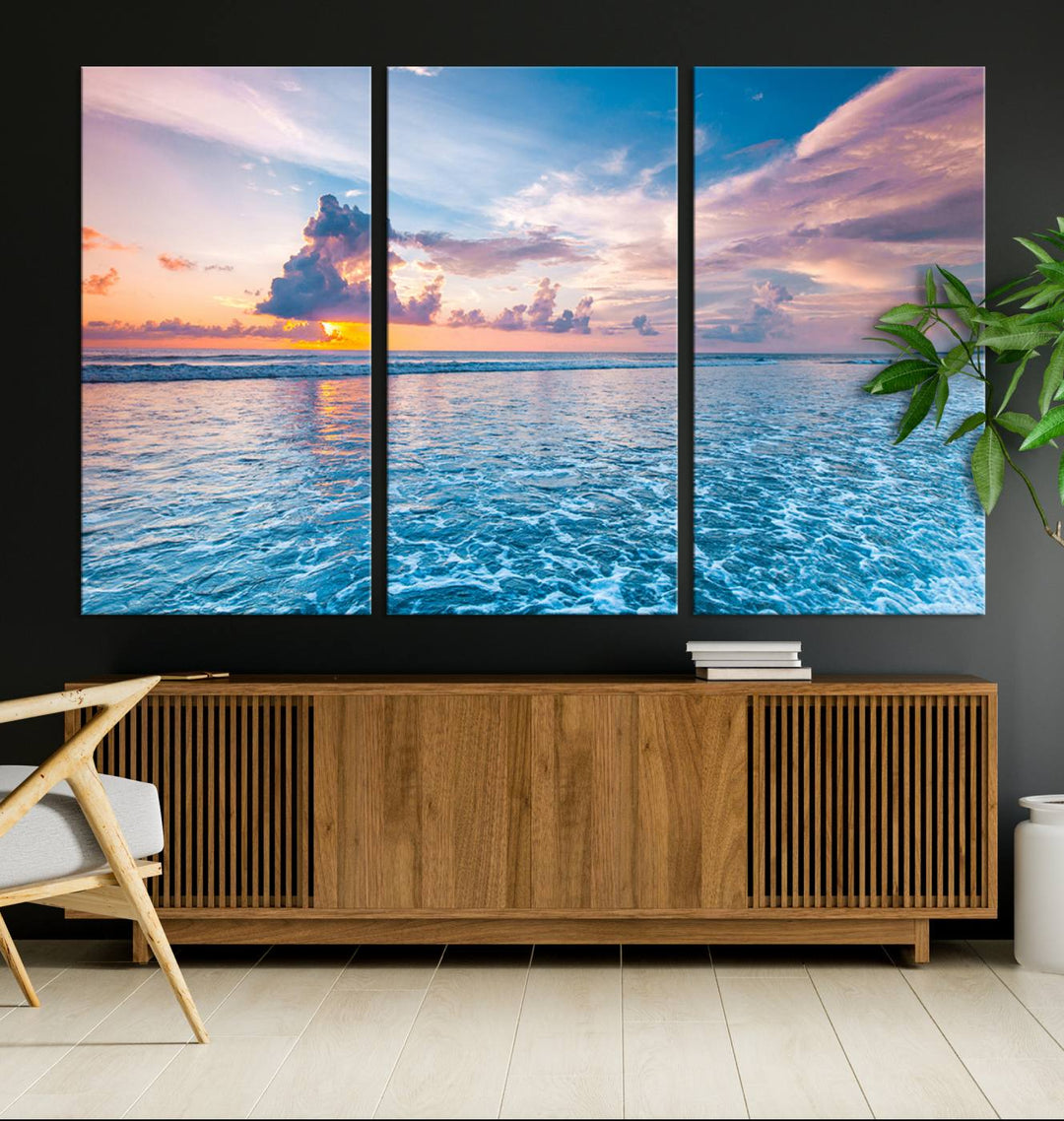 An Ocean Sunset Canvas Wall Art depicting a vibrant sky and rolling waves.