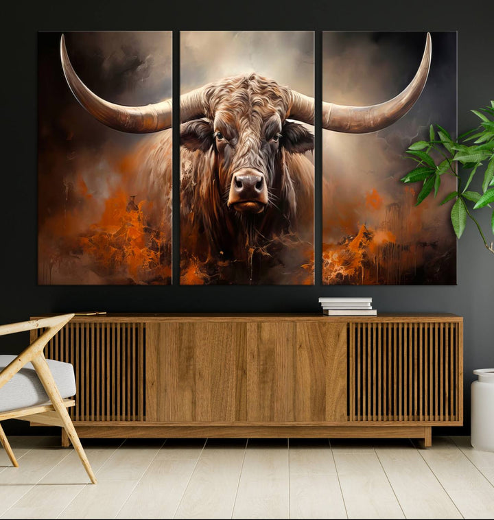 A Highland Bull with striking horns is depicted in a fiery abstract style on a ready-to-hang wall art canvas, evoking strength.