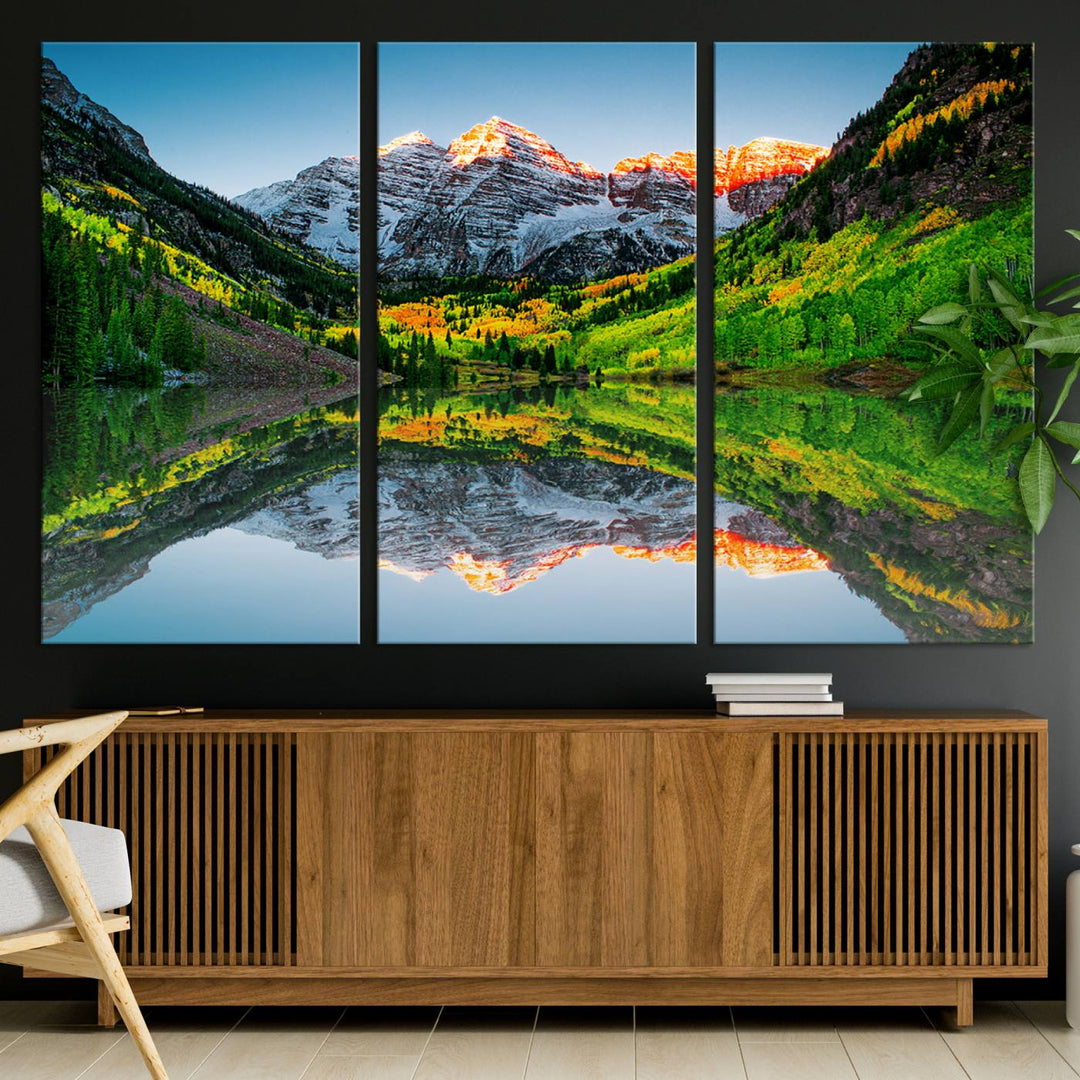 The Sunrise Maroon Bells Lake Wall Art Print beautifully captures North Maroon Peak mirrored in the tranquil lake, framed by lush greenery.