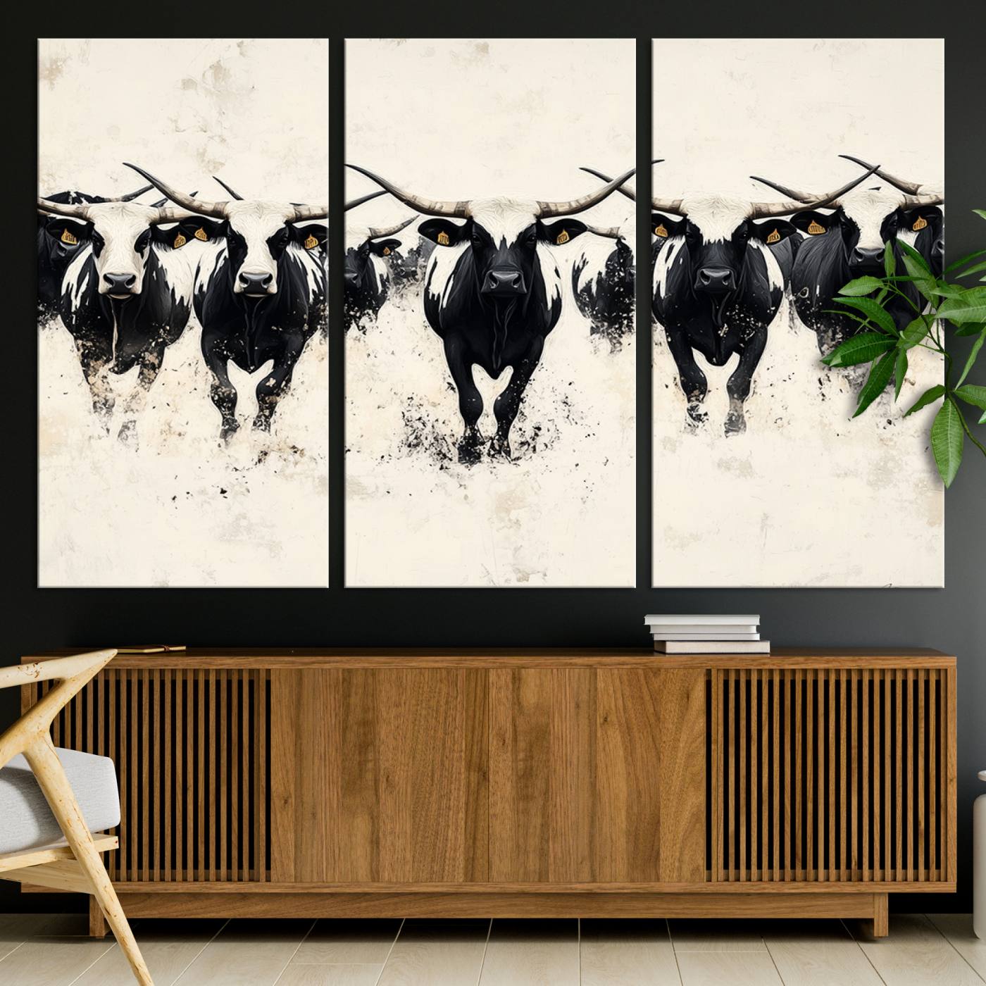 Canvas artwork of black and white Texas longhorns in a bold stampede over a minimalist background, ideal for rustic modern or Western-themed decor.