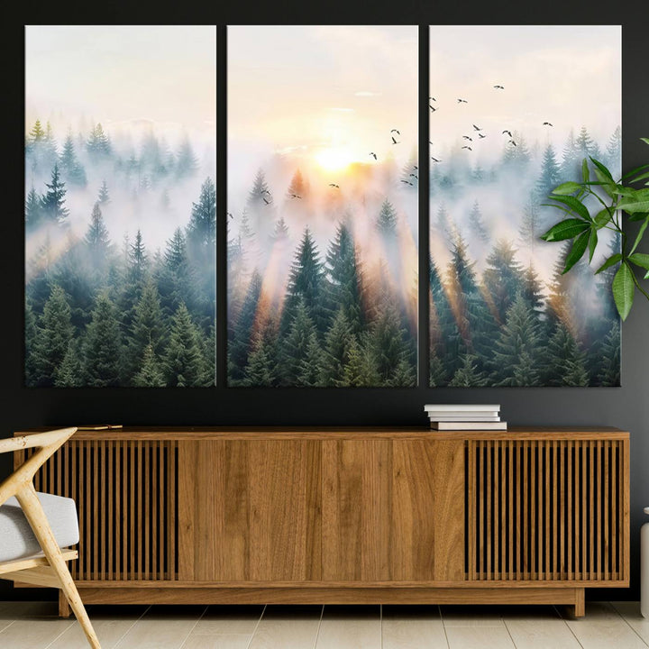 Misty Pine Forest Wall Art: A depiction of sunrise over foggy trees and birds against a bright sky; a framed woodland scene ideal for home or office decor.