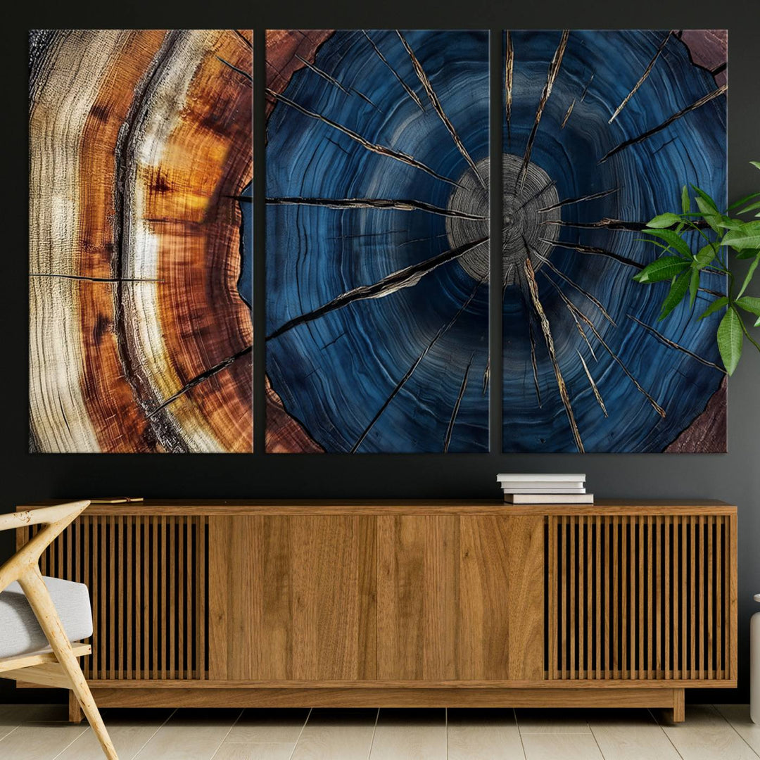 The Abstract Tree Rings Canvas Print features blue, brown, and orange rings that highlight wood grain and natures beauty.