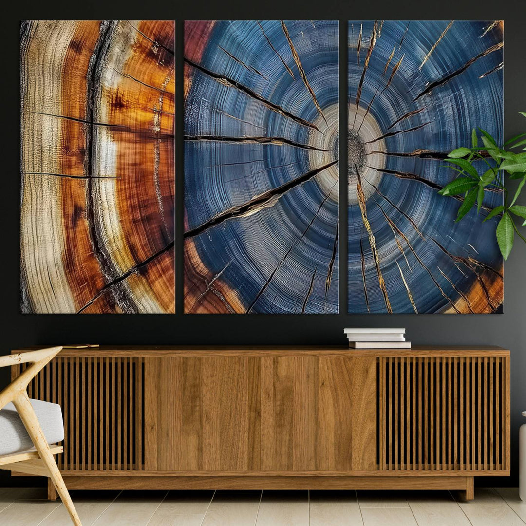 Close-up of blue, brown, and orange wood grain rings on the Abstract Tree Rings Canvas Wall Art Print.