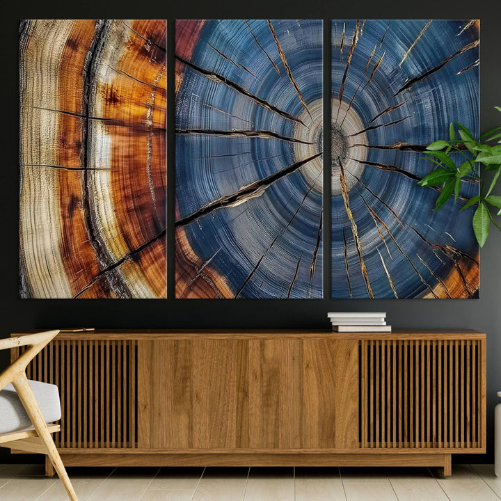 Close-up of blue, brown, and orange wood grain rings on the Abstract Tree Rings Canvas Wall Art Print.