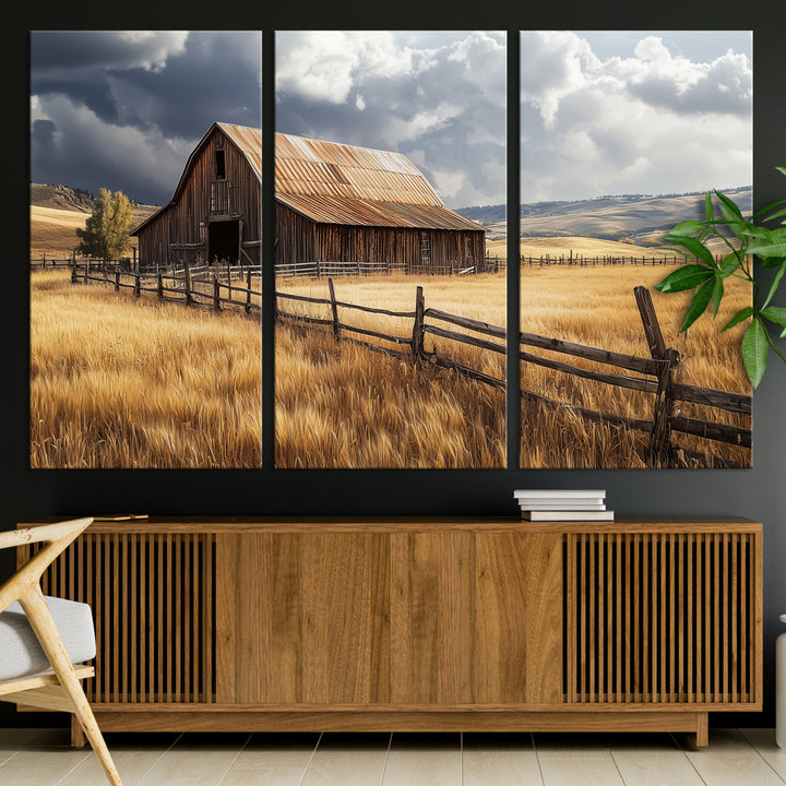 Canvas of a weathered wooden barn in a golden field under a dramatic sky, perfect for rustic or farmhouse-style wall decor.