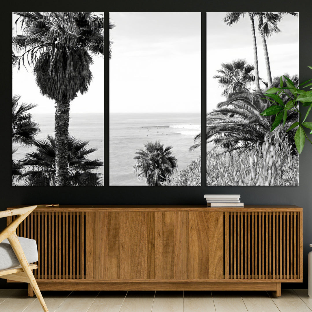 Monochrome canvas of palm trees framing a coastal surf scene, perfect for California-inspired or retro black-and-white beach decor.
