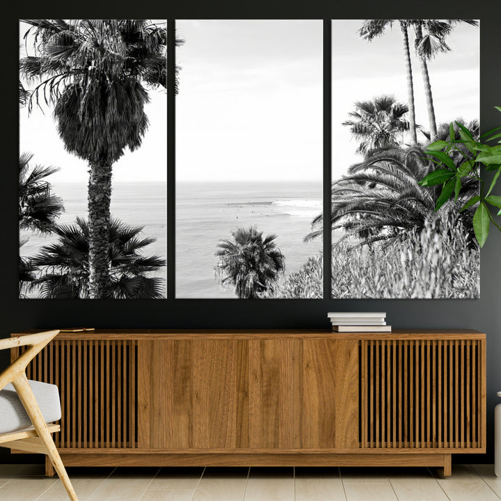 Monochrome canvas of palm trees framing a coastal surf scene, perfect for California-inspired or retro black-and-white beach decor.