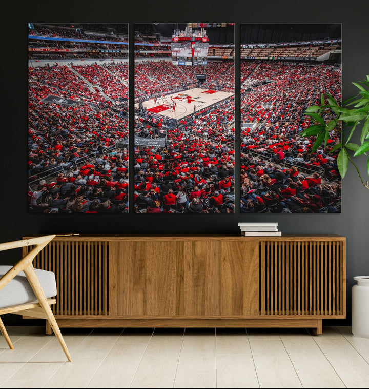 A painting of Louisville Cardinals fans in red at the KFC Yum Center Arena.