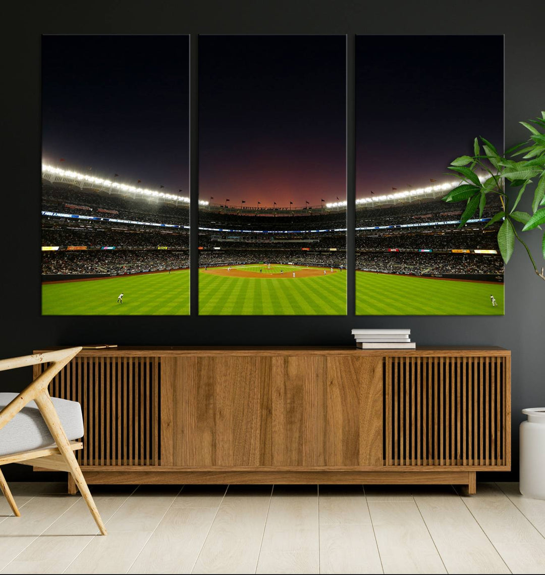 A night game at Yankee Stadium depicted on canvas beneath a sunset sky.