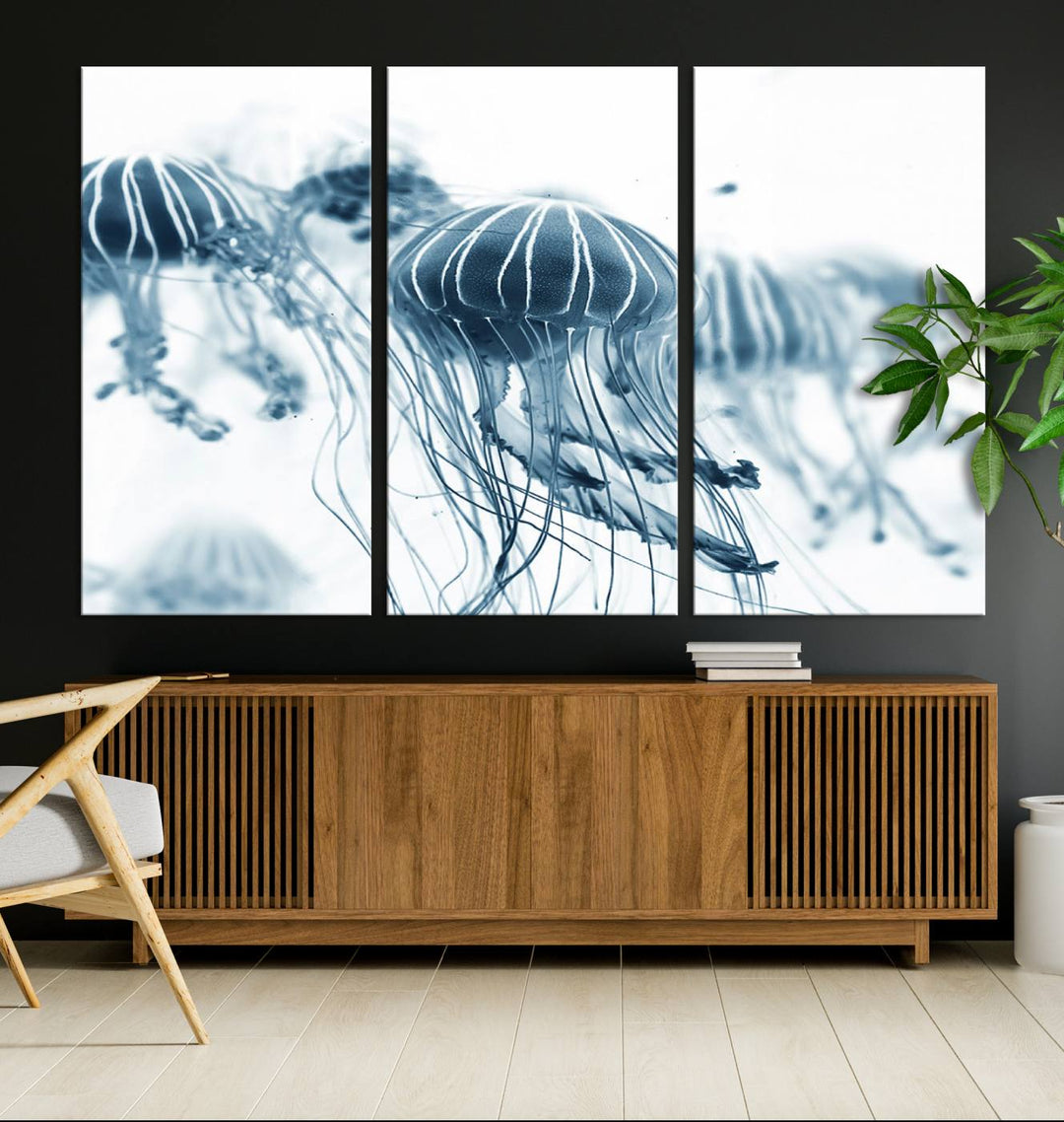 The Abstract Jellyfish Wall Art Canvas Print, a three-panel piece featuring high-resolution printing, hangs elegantly in the room, adding vibrant detail to the space.