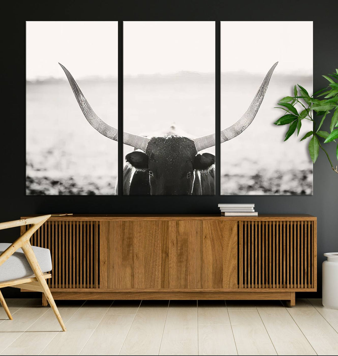 A captivating Black and White Longhorn Wall Art, featuring a triptych of a bull with impressive horns, perfectly suits those who admire Western Longhorn Canvas Prints. This ready-to-hang and framed piece beautifully merges farmhouse wall art with contemporary style.