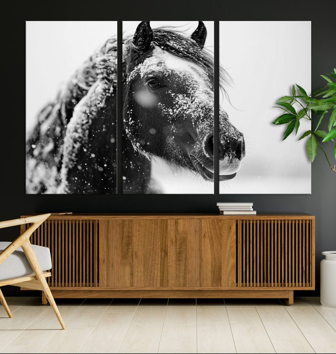 The Winter Horse Canvas Print, a large three-panel black and white equine photography piece, adds a touch of rustic farmhouse charm to the minimalist room with its depiction of a snow-covered horse head on a dark wall.