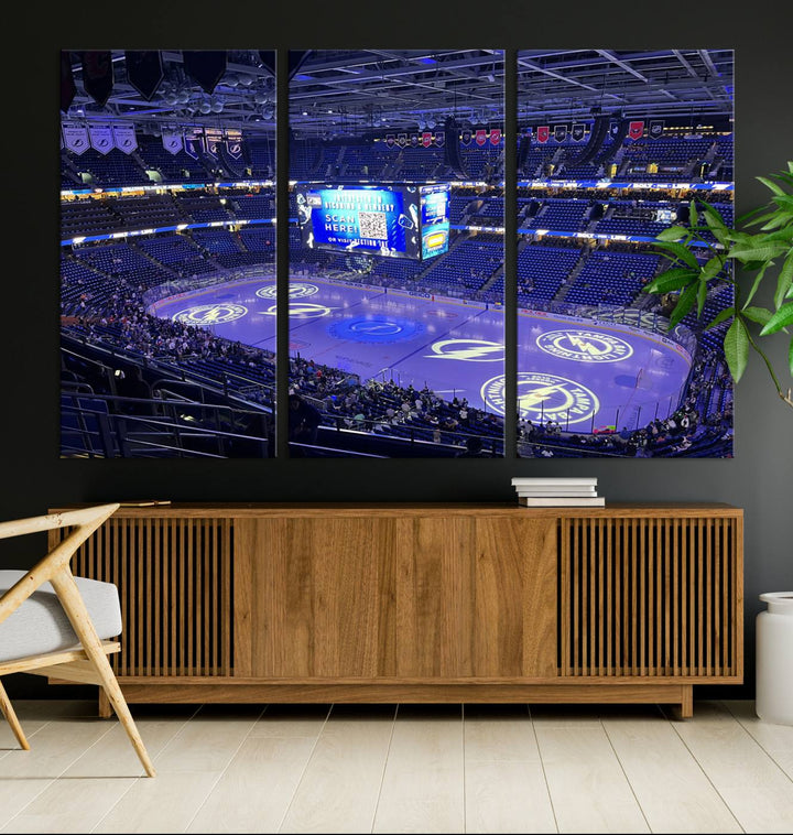 The wall art canvas print at Amalie Arena features team logos on ice, encapsulating the vibrant atmosphere of an NHL hockey stadium.