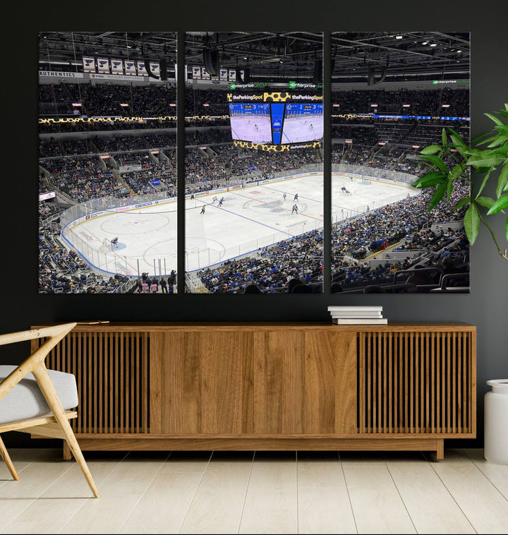 A large Enterprise Center canvas of a crowded hockey arena hangs prominently.