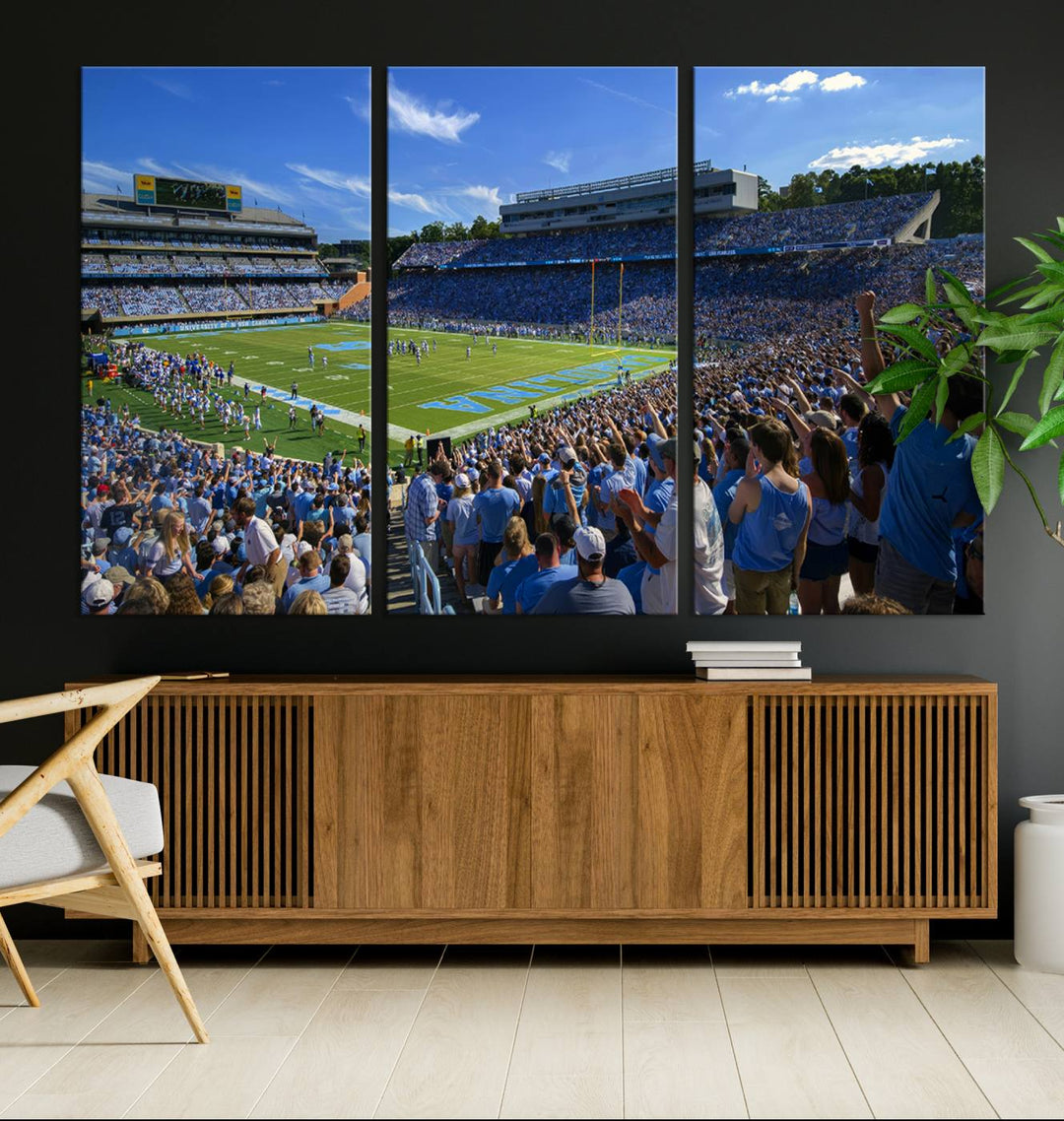 A gallery-quality canvas wall art print featuring the University of North Carolina Tar Heels Football Team and Chapel Hill's Kenan Memorial Stadium adorns the cafe wall.