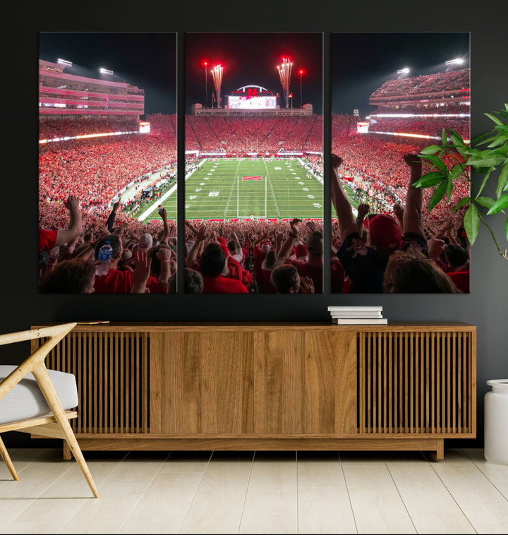 The University of Nebraska Cornhuskers Football Team Print, a vibrant three-panel canvas depicting Lincoln Memorial Stadium filled with enthusiastic fans from the end zone perspective, features a gallery-quality finish.