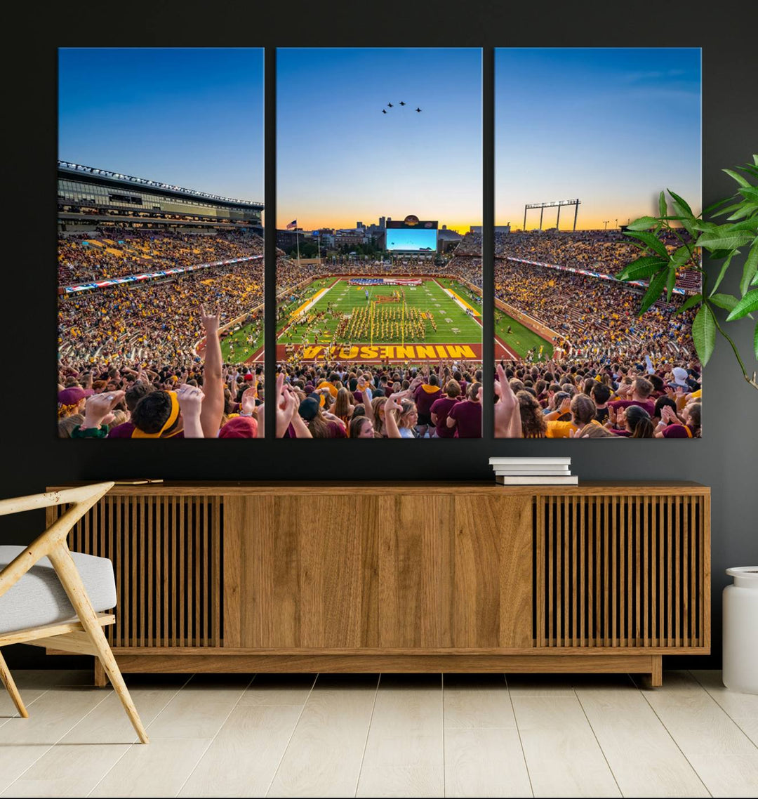 Canvas wall art featuring the University of Minnesota Football Team print, showcasing Huntington Bank Stadium at sunset with jets overhead.