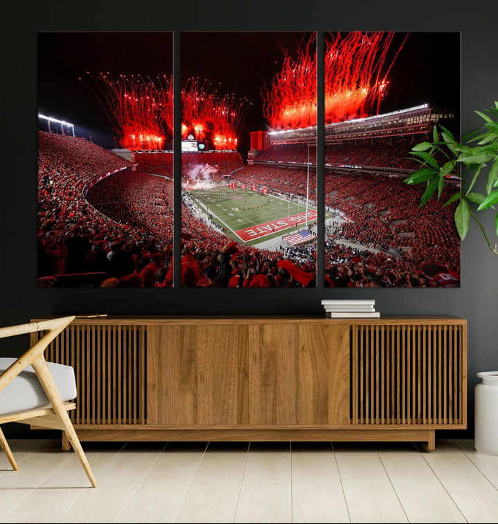 A vibrant red canvas art of a packed Ohio State Buckeyes stadium at night with fireworks.