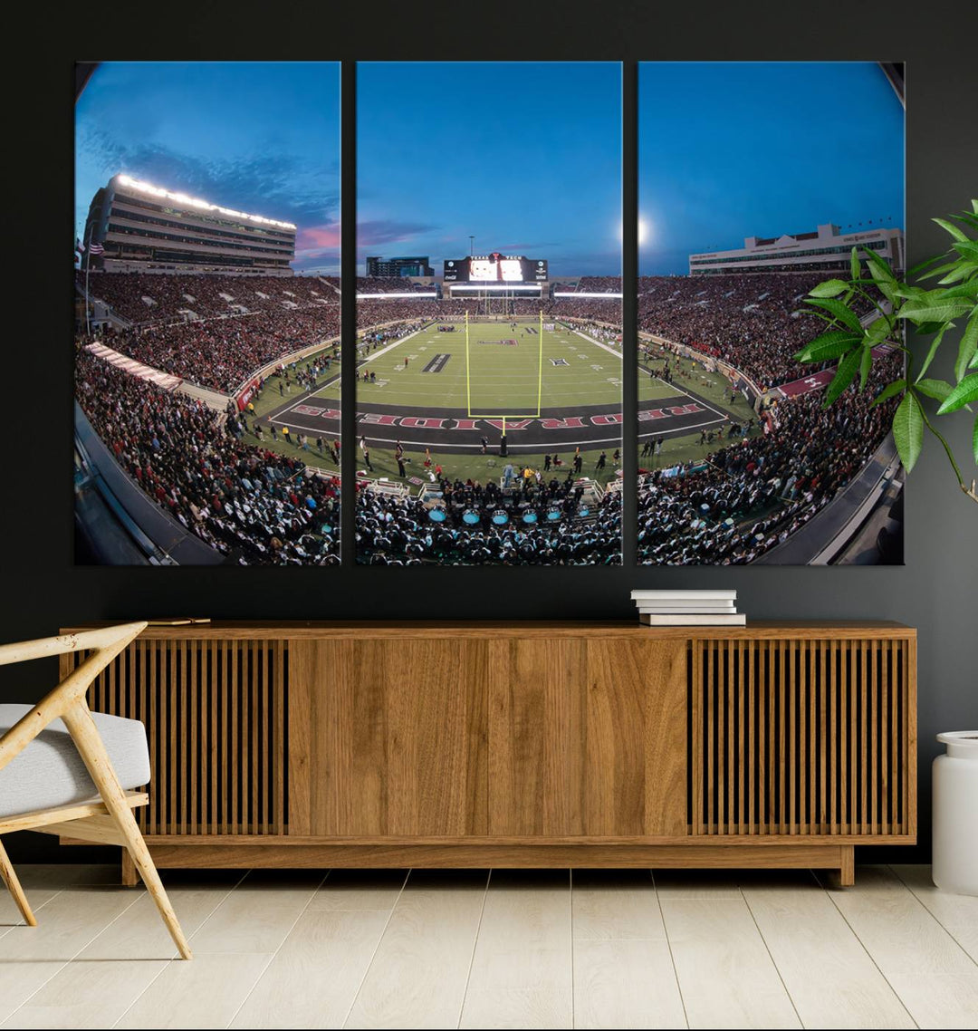 The wall art in the living room features a Texas Tech Red Raiders Football Team Print, showcasing Jones AT&T Stadium at dusk.