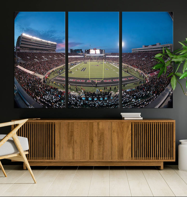 The wall art in the living room features a Texas Tech Red Raiders Football Team Print, showcasing Jones AT&T Stadium at dusk.