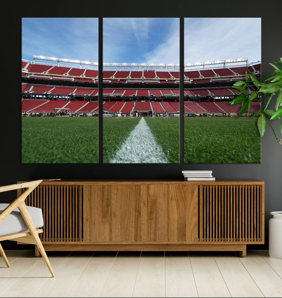 A canvas print of the University of Tulsa Golden Hurricane showcases H.A. Chapman Stadiums football field and red seats against a backdrop of a blue sky.