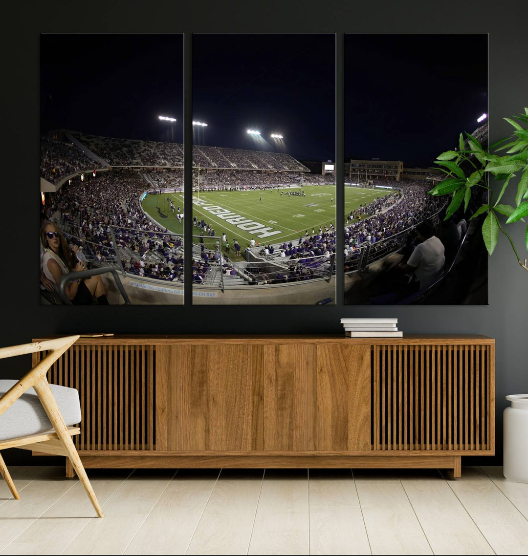 The wall art print features a night view of Amon G. Carter Stadium filled with TCU fans, showcased in the Horned Frogs Football Canvas Wall Art.