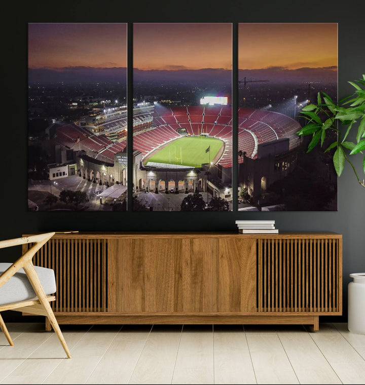 The USC Trojans Stadium canvas captures Memorial Coliseum at twilight, showcasing red seats and a green field beneath an orange sky.