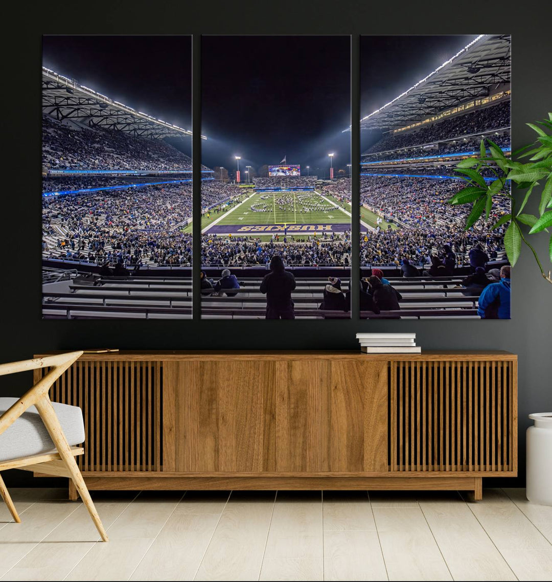 A canvas print titled The University of Washington Huskies Football depicts a packed Husky Stadium at night, as seen from the stands.