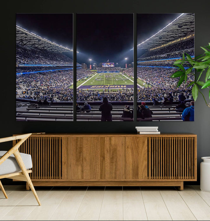 A canvas print titled The University of Washington Huskies Football depicts a packed Husky Stadium at night, as seen from the stands.